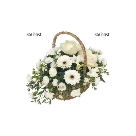 Send basket with white flower by courier.