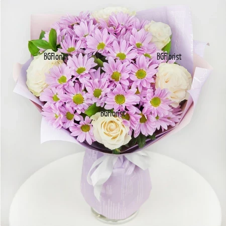 Send a bouquet of white roses and pink chrysanthemums.