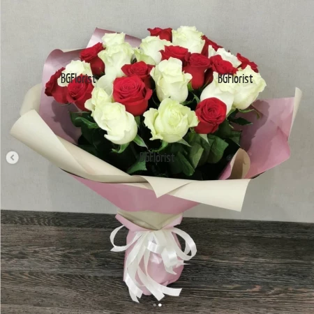 Send flowers - a bouquet of 35 white and red roses.